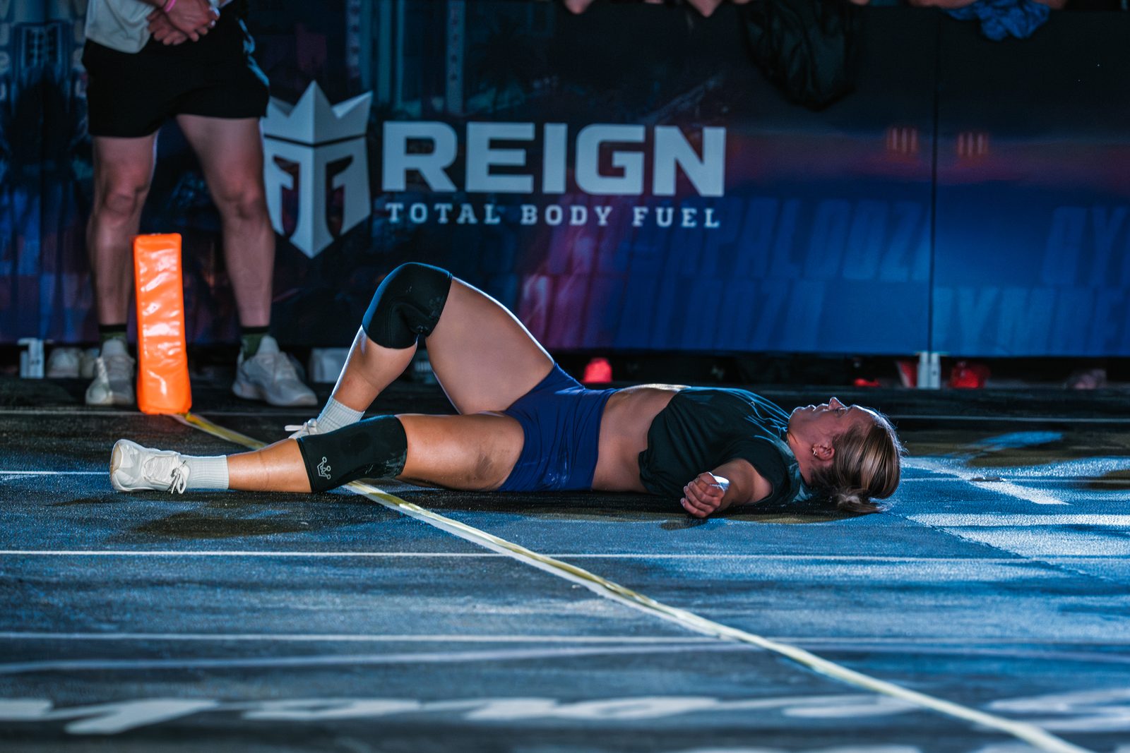 Flat on her back on the competition floor after the last rep